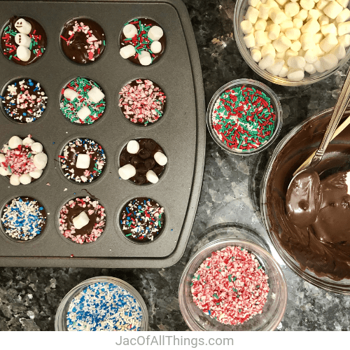 Decorate the top of your hot chocolate on a stick with sprinkles, marshmallows, and crushed candy canes.