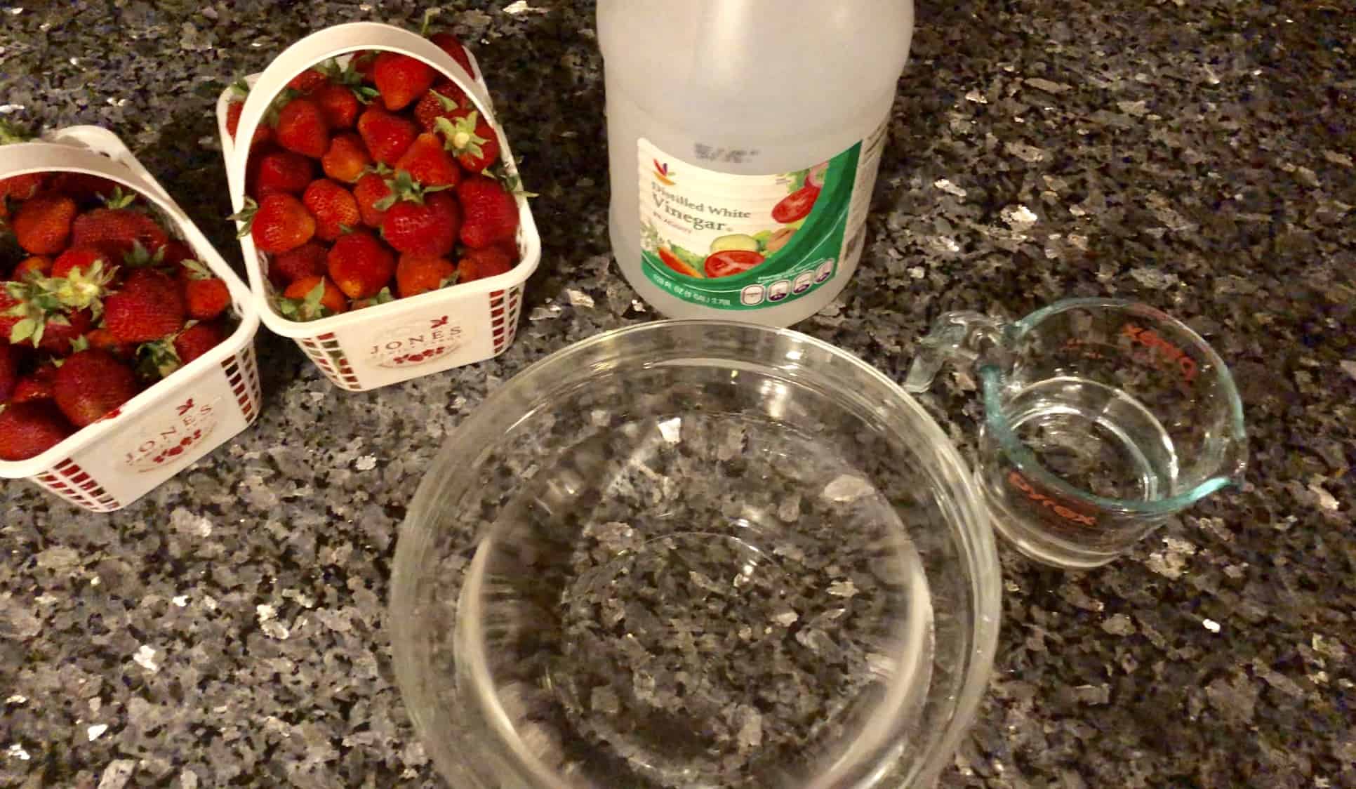 Create a vinegar bath to keep strawberries fresh