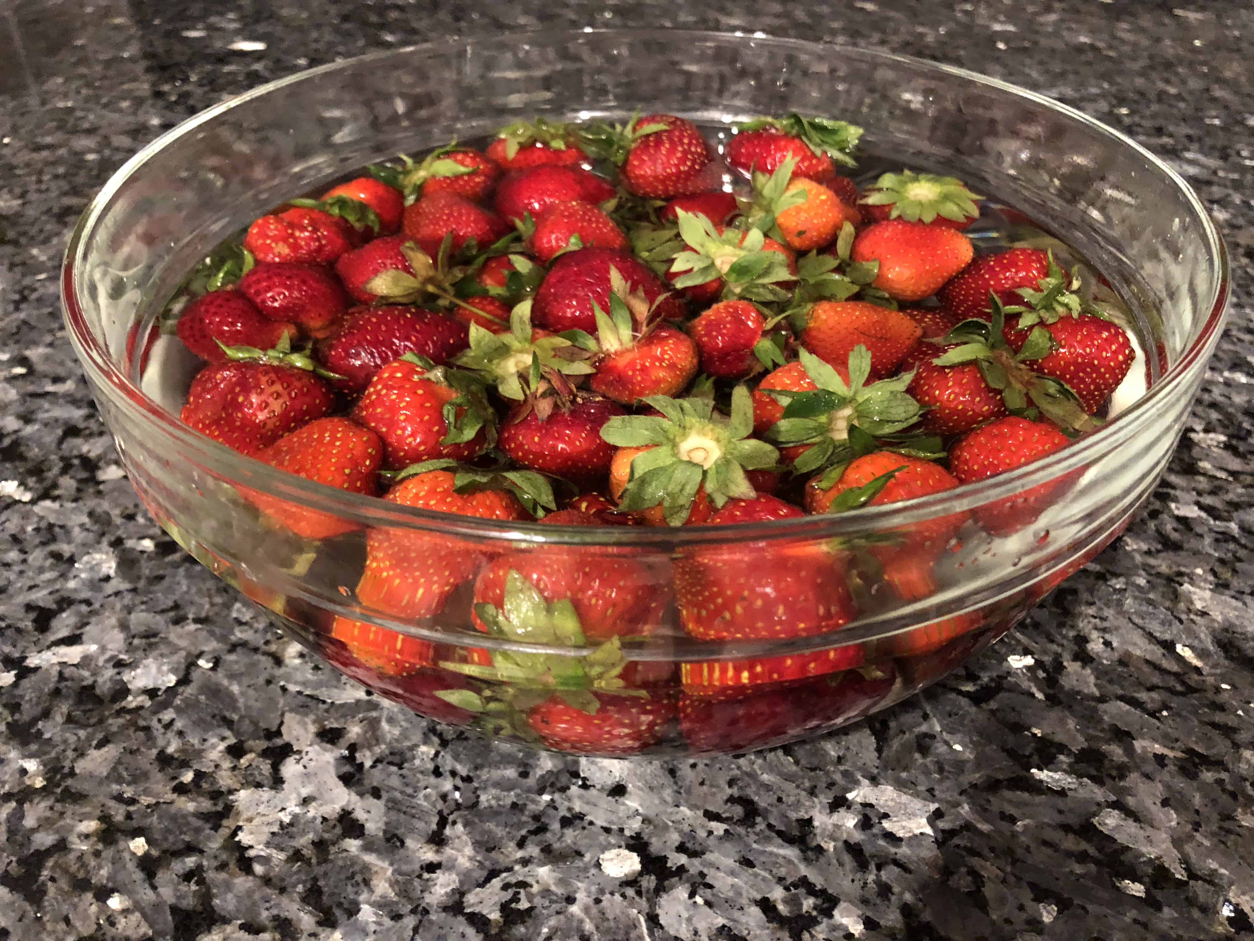 Soak strawberries in vinegar and water to keep strawberries fresh